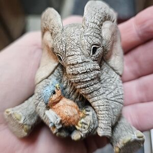 Miniature Baby Elephant holding bird Tuskers Love Is Caring